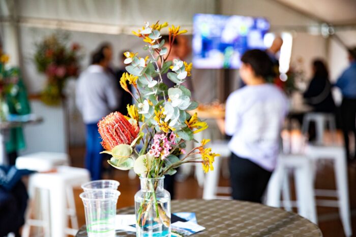 A flower arrangement on a table at the Invest Wollongong hospitality event